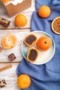 Truffle chocolate tangerine candies on a white wooden background. top view, close up Royalty Free Stock Photo