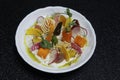 truffle flavored cream cheese and baby vegetable dish, mediterranean cuisine with black background