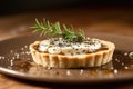 Truffle And Goat Cheese Tartlet Garnished With Fresh Herbs. Generative AI