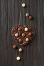 Truffles in chocolate chips in a heart-shaped box Royalty Free Stock Photo