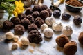 truffles in various stages of preparation on a marble surface