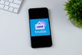 Trulia Rent Apartments & Homes app logo on a smartphone screen.