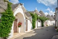 Trulli of Alberobello, Puglia, Italy: Typical houses built with dry stone walls and conical roofs. In a beautiful sunny day. Royalty Free Stock Photo