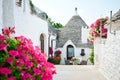 Trulli of Alberobello, Puglia, Italy: Typical houses built with dry stone walls and conical roofs. In a beautiful sunny day. Royalty Free Stock Photo