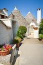 Trulli of Alberobello, Puglia, Italy: Typical houses built with dry stone walls and conical roofs. In a beautiful sunny day. Royalty Free Stock Photo