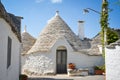 Trulli of Alberobello, Puglia, Italy: Typical houses built with dry stone walls and conical roofs. In a beautiful sunny day. Royalty Free Stock Photo