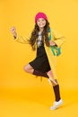 Truly energetic. Energetic girl hurry to school. Active small child on yellow background. High energy schoolkid. Little
