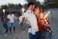 Truly happy playful couple having fun at beach