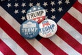 Trump 2020 badge pins and United States flag.