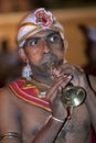 A Trumpet Blower performs during the Esala Perahera in Kandy, Sri Lanka.