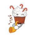 With trumpet christmas cupcake in the character fridge Royalty Free Stock Photo