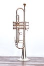 Trumpet instrument over white background.