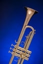 Trumpet Isolated on Blue Royalty Free Stock Photo