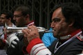 A trumpet player during a religious parade through the streets of Cadiz, Spain