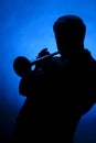 Trumpet Player Silhouette on Blue Royalty Free Stock Photo