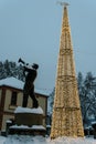 Trumpeter statue with Christmas decoration in center of Guca, Serbia Royalty Free Stock Photo