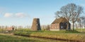 Truncated windmill in an rural landscape