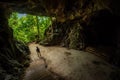 Trung Trung Cave Cat Ba Vietnam Girl Tourist admires beautiful Stalactite formations Royalty Free Stock Photo