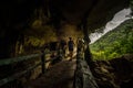 Trung Trung Cave Cat Ba Vietnam Girl Tourist standing at the entrance Royalty Free Stock Photo