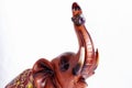 On trunk figurine brown elephant wearing a silver ring