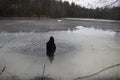 Trunk in a Semi Frozen Pond