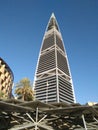 Truss elements covering garage nd skyscraper in the background