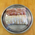 Trussed pork loin with rosemary on a steel tray Royalty Free Stock Photo
