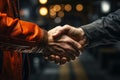 Trust forged Mechanic and client exchange handshake, affirming successful garage repair experience