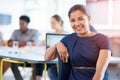 Trust me, Ill get the job done. Portrait of a happy young businesswoman sitting in her office. Royalty Free Stock Photo