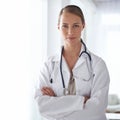 Trust in me. Portrait of an attractive young doctor standing with her arms folded. Royalty Free Stock Photo