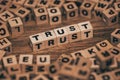 Trust symbol, The word Trust arranged among scattered letters, Business concept, trust and responsibility