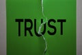 Trust Text on Green paper background with crack in the middle Royalty Free Stock Photo