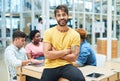 Trust us to keep your designs on track. a young businessman having a meeting with his team in a modern office. Royalty Free Stock Photo