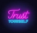 Trust yourself neon inspirational quote on a brick wall background.