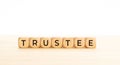 Trustee word on wooden block Royalty Free Stock Photo