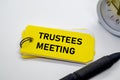Trustees Meeting notepad with keyring on yellow background Royalty Free Stock Photo