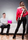 Trusting guy giving present to misleading girl