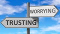 Trusting and worrying as a choice - pictured as words Trusting, worrying on road signs to show that when a person makes decision