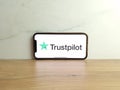 Trustpilot reviews website logo displayed on mobile phone