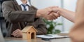 Trustworthy Real Estate Agent Concluding Deal with Client Through Solid Handshake Royalty Free Stock Photo