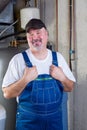 Trustworthy workman in a basement utility room