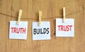 Truth builds trust symbol. Concept words Truth builds trust on white paper on clothespin on a beautiful wooden table wooden