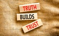 Truth builds trust symbol. Concept words Truth builds trust on wooden blocks on a beautiful canvas table canvas background. Royalty Free Stock Photo