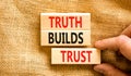 Truth builds trust symbol. Concept words Truth builds trust on wooden blocks on a beautiful canvas table canvas background. Royalty Free Stock Photo