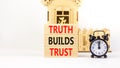 Truth builds trust symbol. Concept words Truth builds trust on wooden blocks on a beautiful white table white background. Black