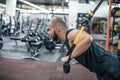 TRX training. Cross fit instructor at the gym doing TRX Excersise. Fitness man workout on the rings. Fitness man in the gym. Royalty Free Stock Photo