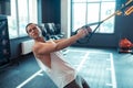 Good looking nice man using trx straps for workout Royalty Free Stock Photo