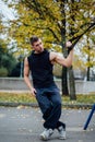 TRX training. Man Instructor at the park doing Excersise. Fitness workout. Royalty Free Stock Photo