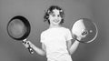 try this. girl with curlers in hair. Fashion home shot. Pin-up style. Girl Holding Frying Pan. Little homemaker holding