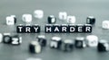 Try harder motivation inspiration quote in black letter block beads. Success, persistence concept